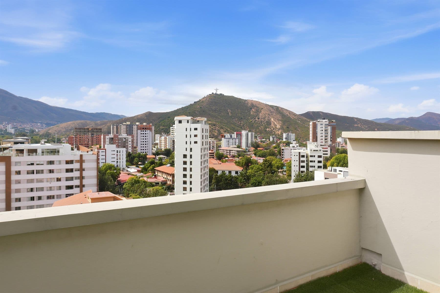 Rooftop terrace with panoramic city and mountain skyline view, finished by the Reborn group