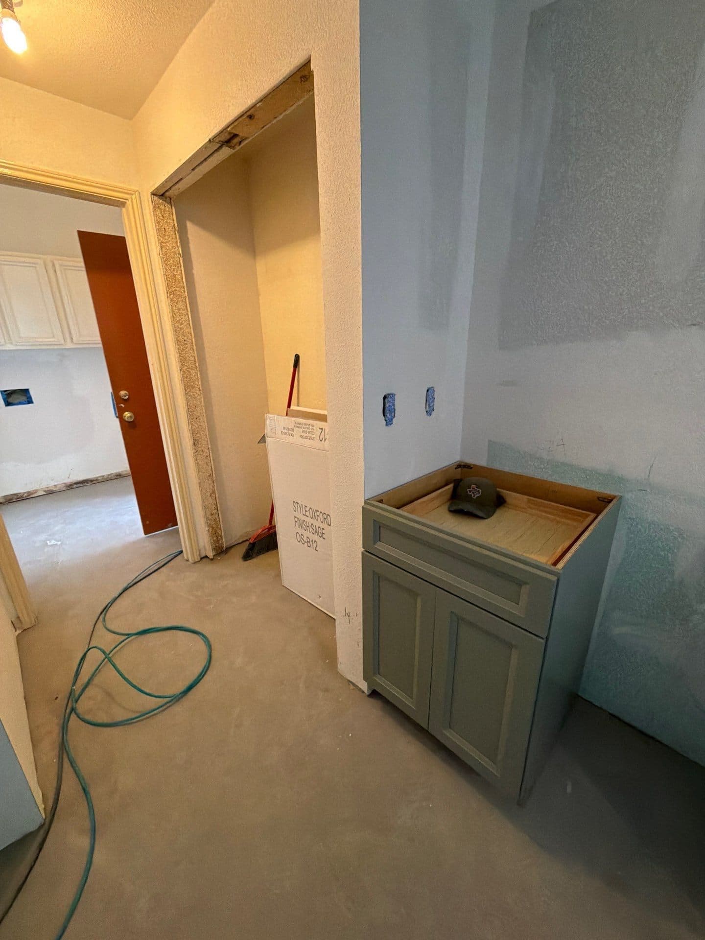New sage vanity installed in the finished bath