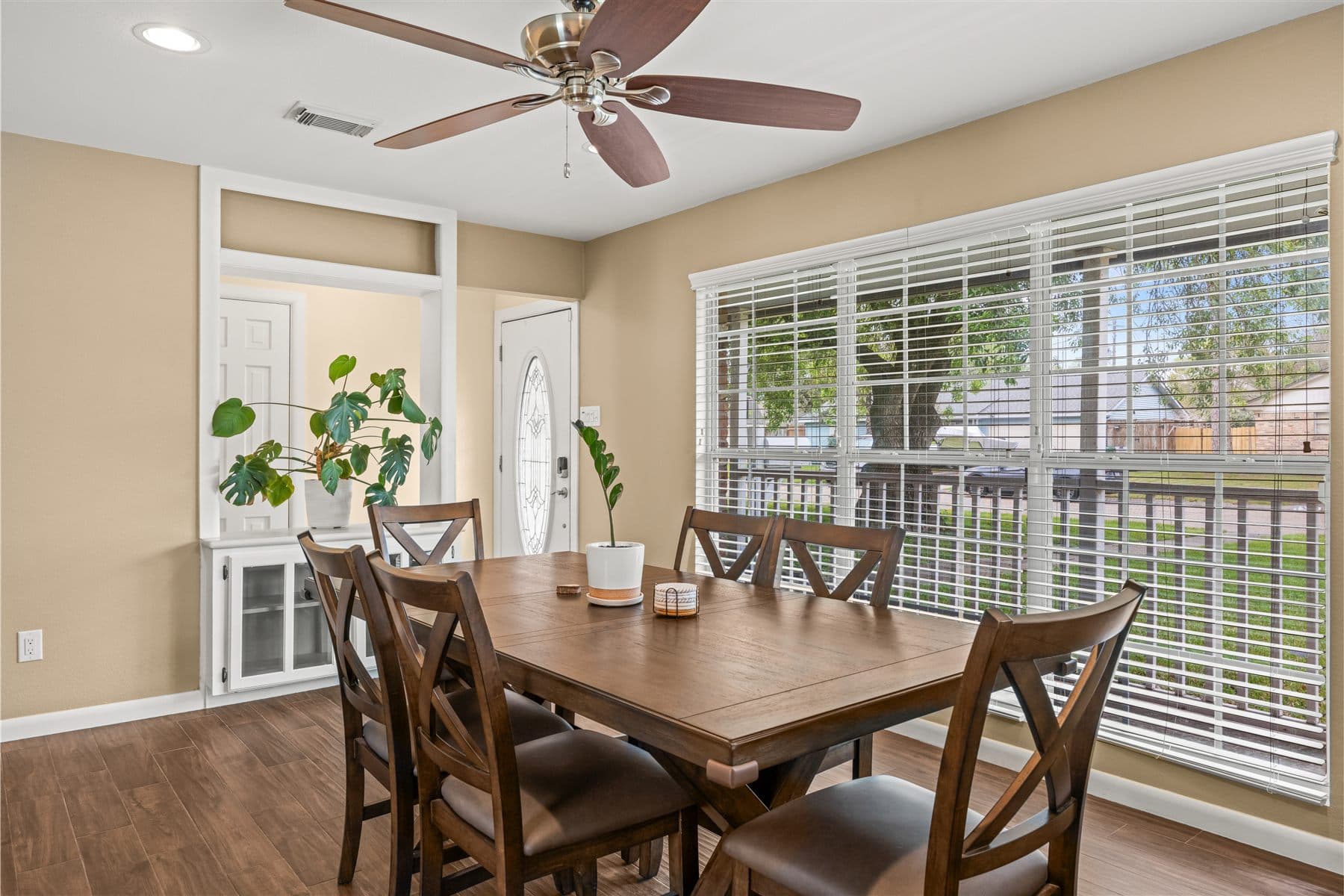 Dining area beside a wall of windows, furnished by the Reborn group