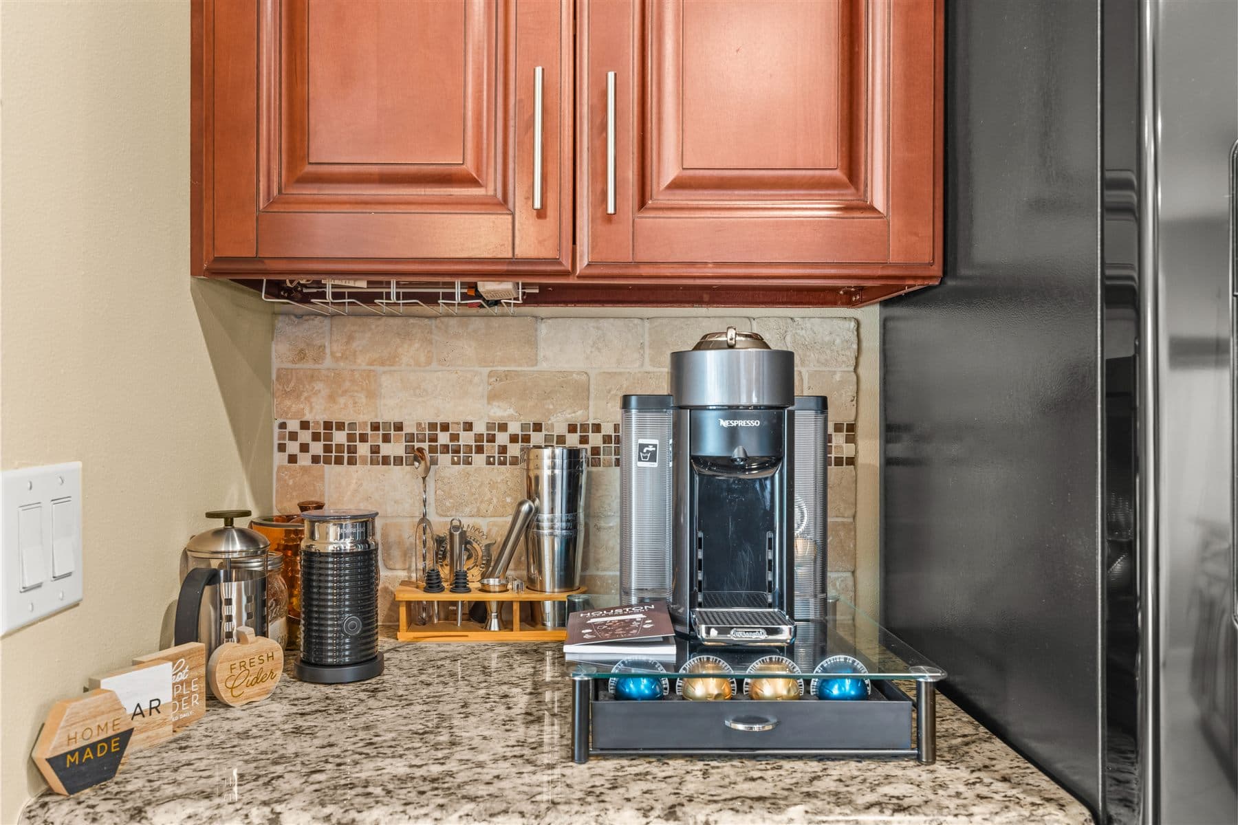 Coffee station stocked and arranged on the finished kitchen counter